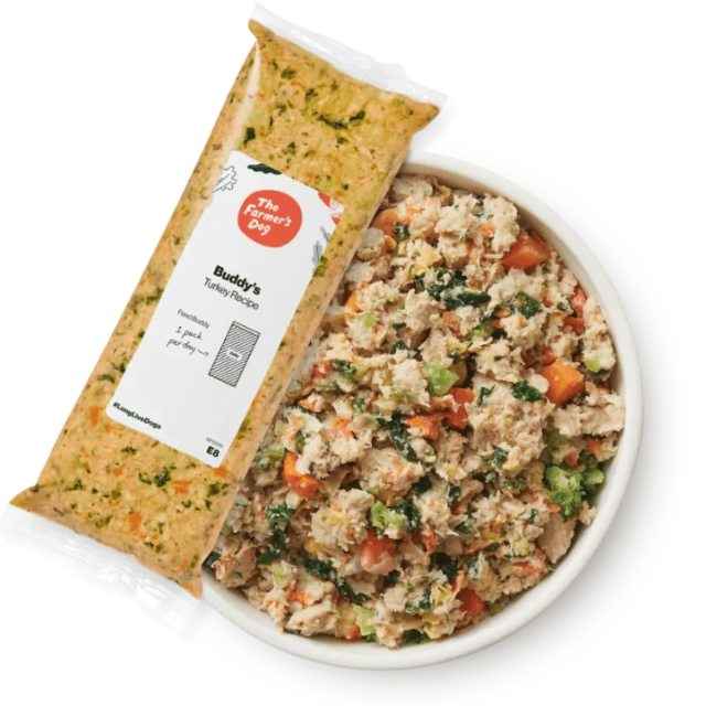 The Farmer's Dog pre-portioned pack of fresh, human-grade turkey recipe dog food next to a full bowl